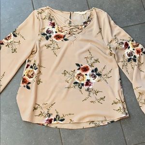 Floral top with criss cross detail at neckline